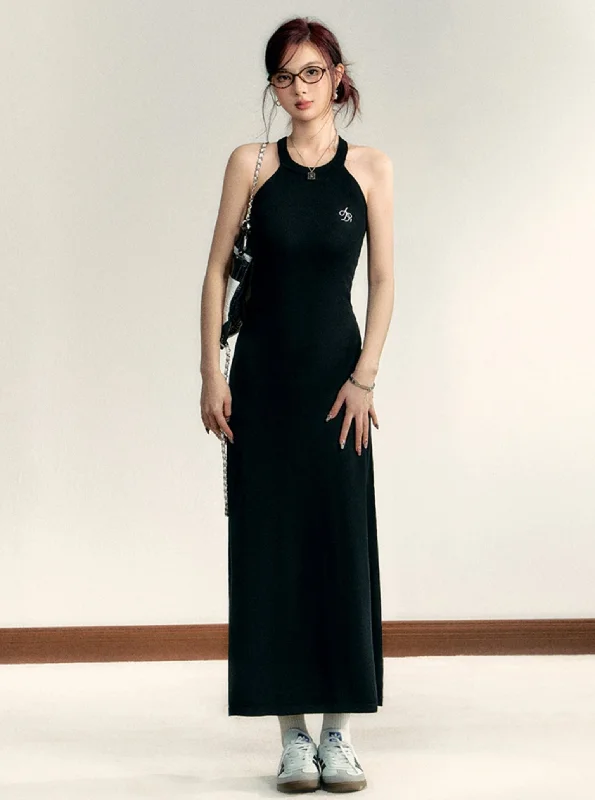 Sleek Halter Neck Maxi Dress: Fitted Black Evening Gown with Minimalist Logo Detail Chic Sleeveless Maxi Dress Sleek Halter Neck Maxi Dress: Fitted Black Evening Gown with Minimalist Logo Detail Chic Sleeveless Maxi Dress